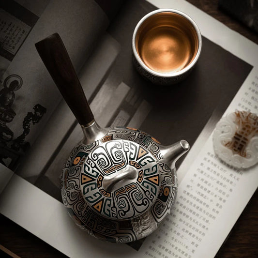 Handmade gilded silver teapot close-up